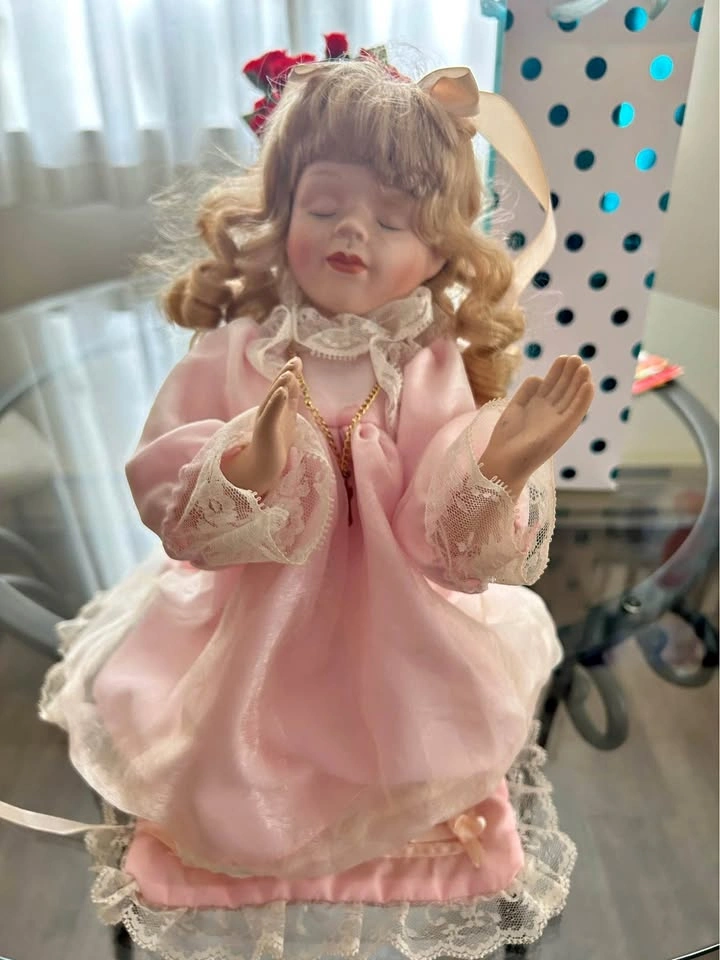 Porcelain prayer doll