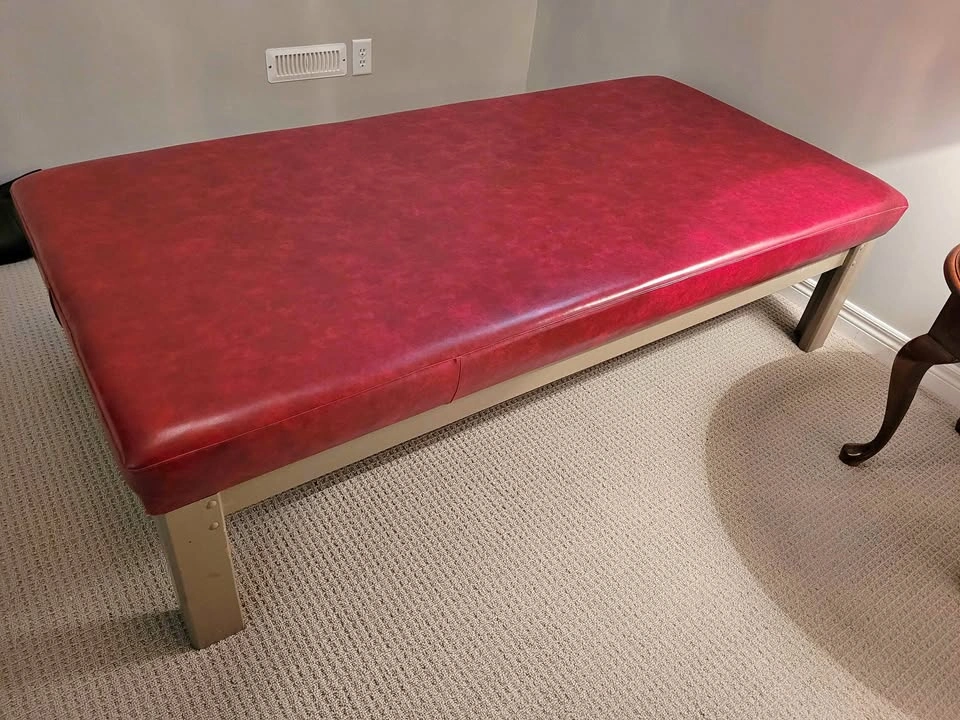 Strong steel bench with thick foam top and covered with vinyl.