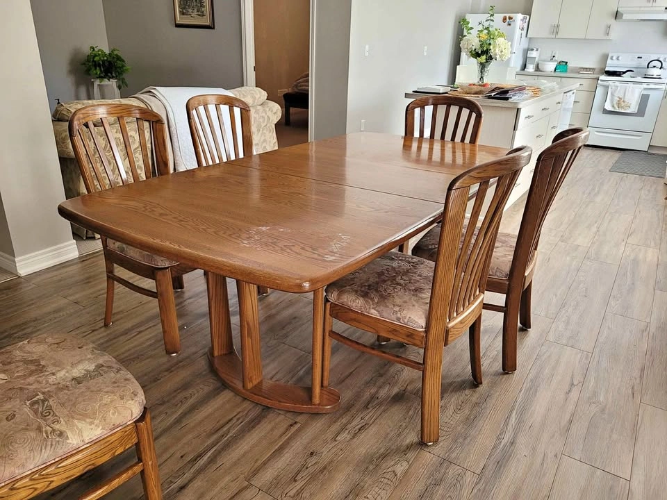 Solid dark wood kitchen table and 6 chairs