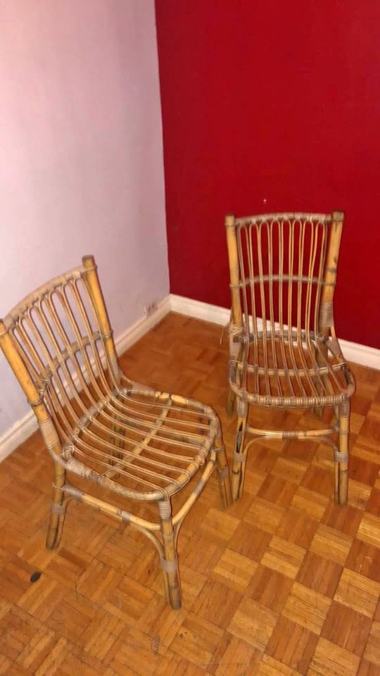 A pair of wicker chairs 2