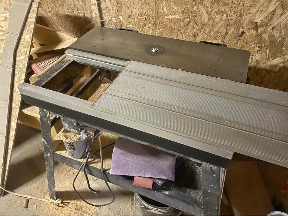 Woodworking tools. Router table with sliding top
