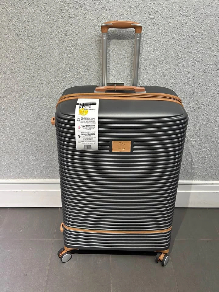 New, good brand, extra large expandable hard-side suitcase.