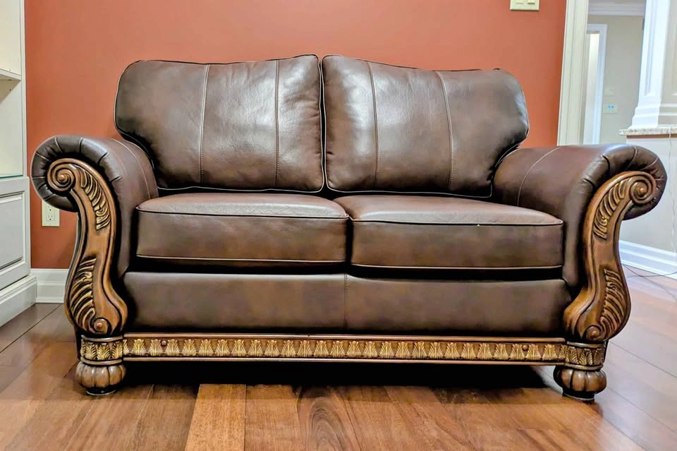 Ashley Furniture Dark Brown Leather Loveseat w/ Wood Trim