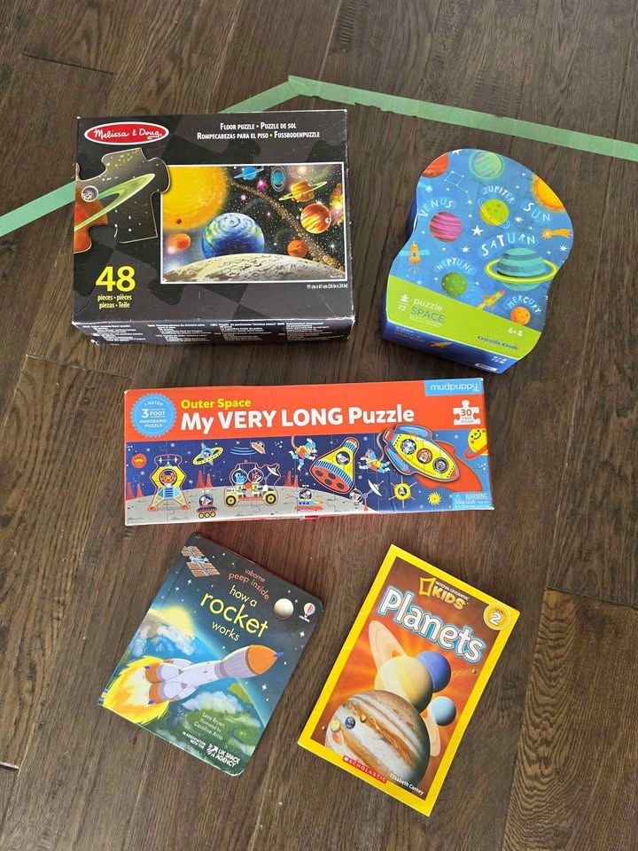 Space theme puzzles and books