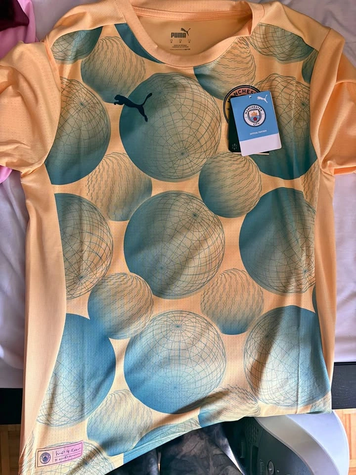 Man city pre match jersey