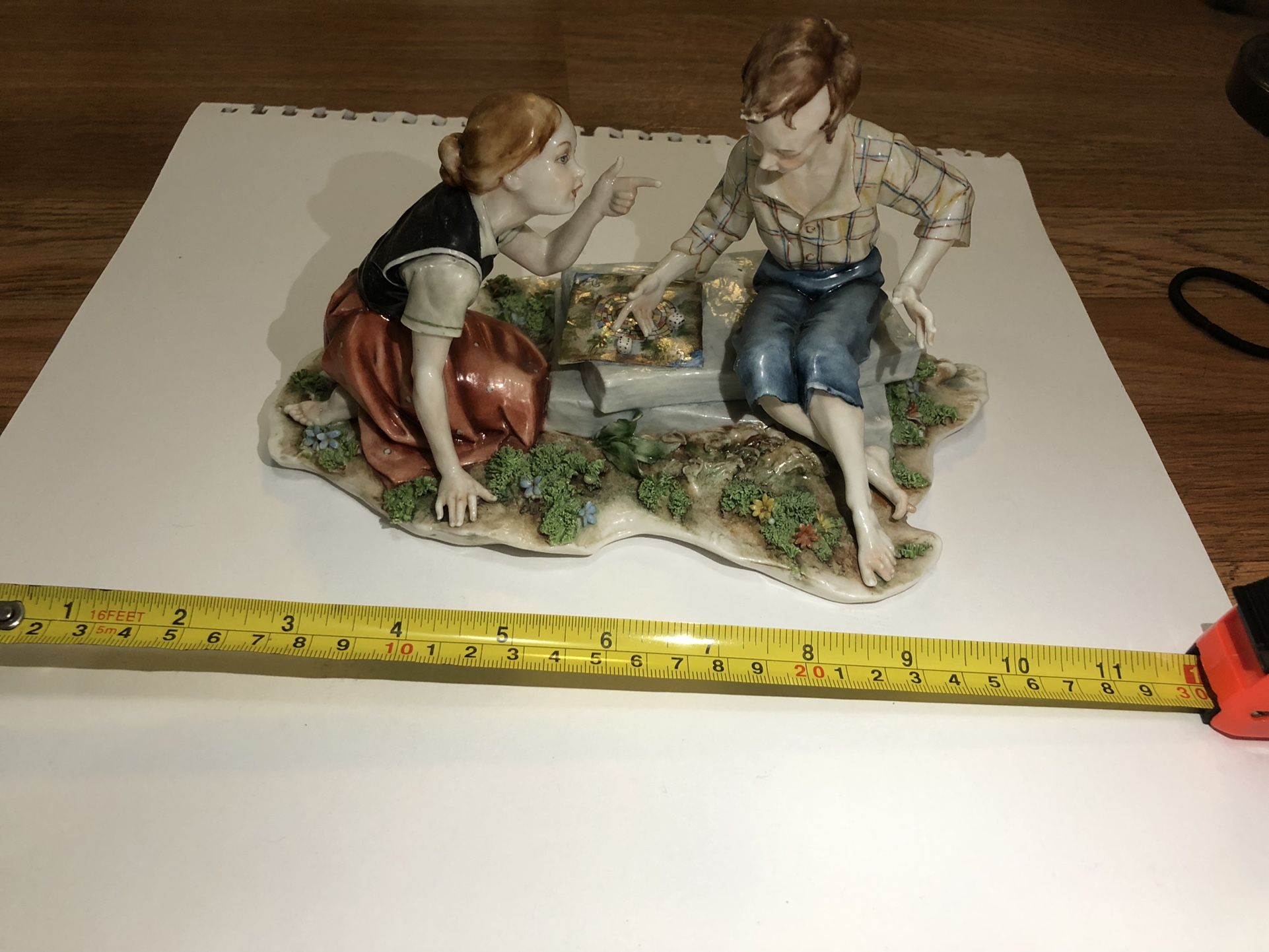 Boy And Girl Playing Porcelain Statue