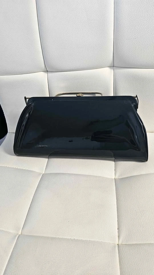 Black patent leather clutch bag