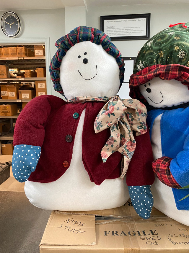 Very large stuffed snowman and snowwoman