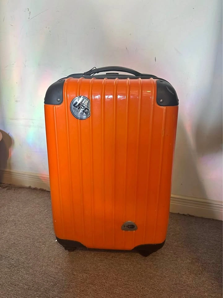 Orange carry-on luggage hard shell