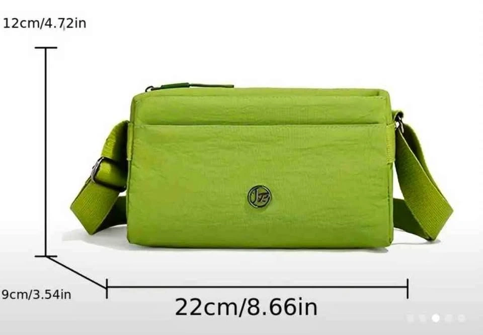 Brand new multiple compartments green color small handbag for wo