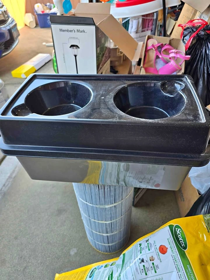 Elevated dog feeder with storage for food.