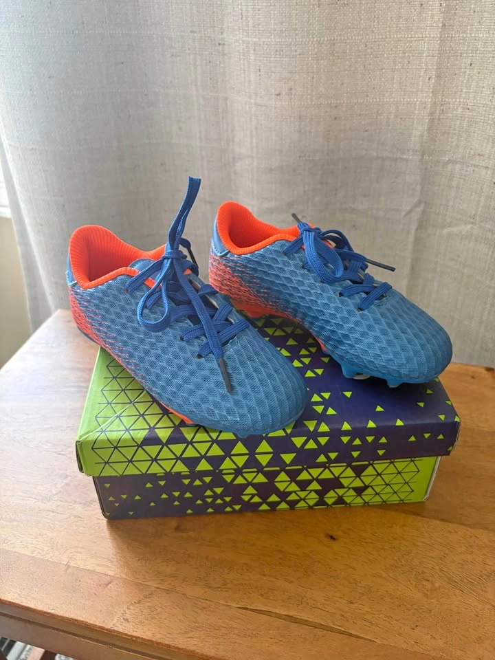 Blue and orange soccer cleats