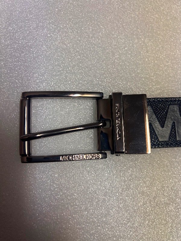 Brand new Micheal Kors Embossed Blue Adjustable Leather Belt