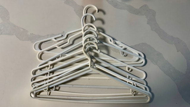 10 White Plastic Hangers