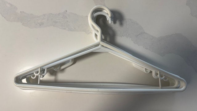 10 White Plastic Hangers - photo 2