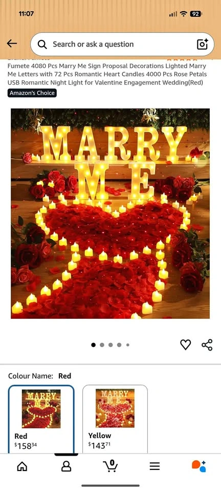 Marry Me Sign with fake rose petals and tea cup candle lights. U