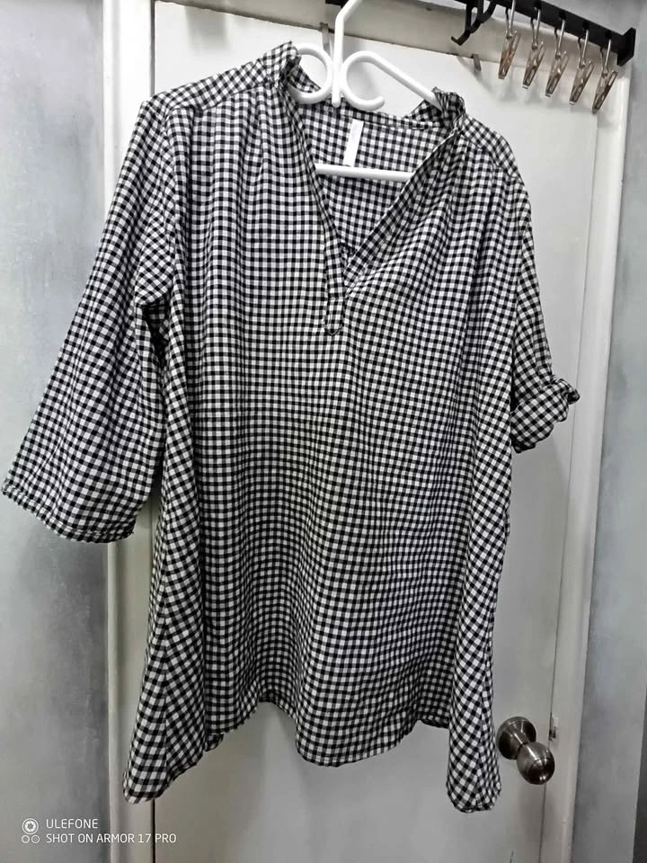 Black and white checkered blouse