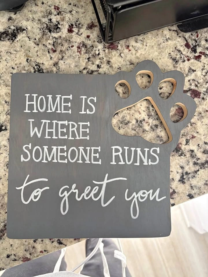 Home is where someone runs to greet you sign