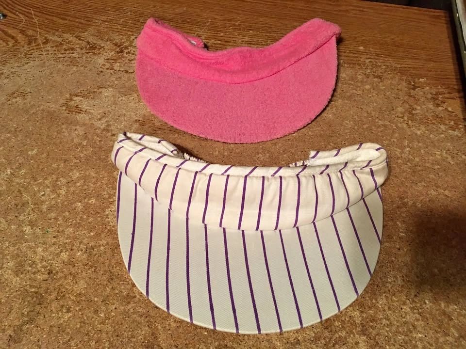 LOT OF TWO LADIES VISORS PINK FUZZY AND WHITE & PURPLE STRIPED