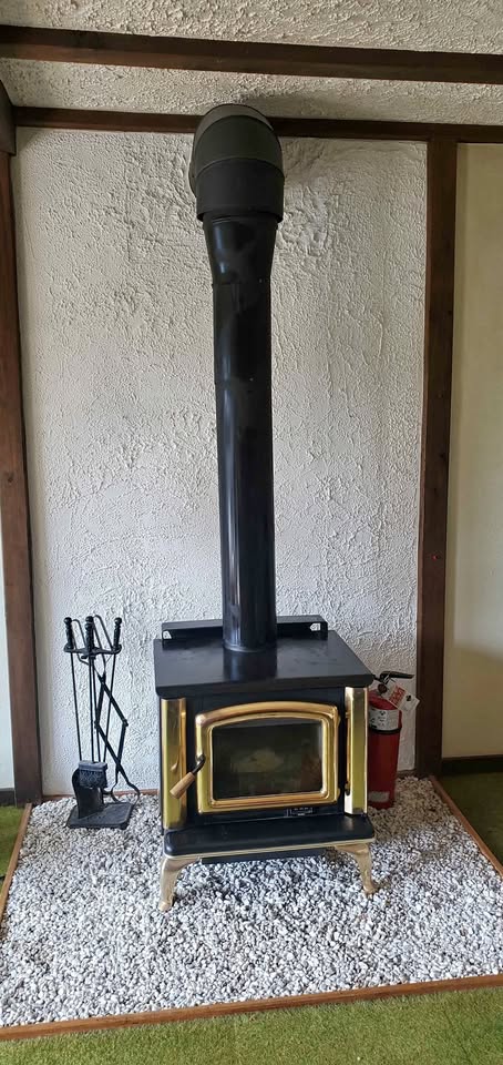 Iron Wood-Burning Stove with Brass Trim