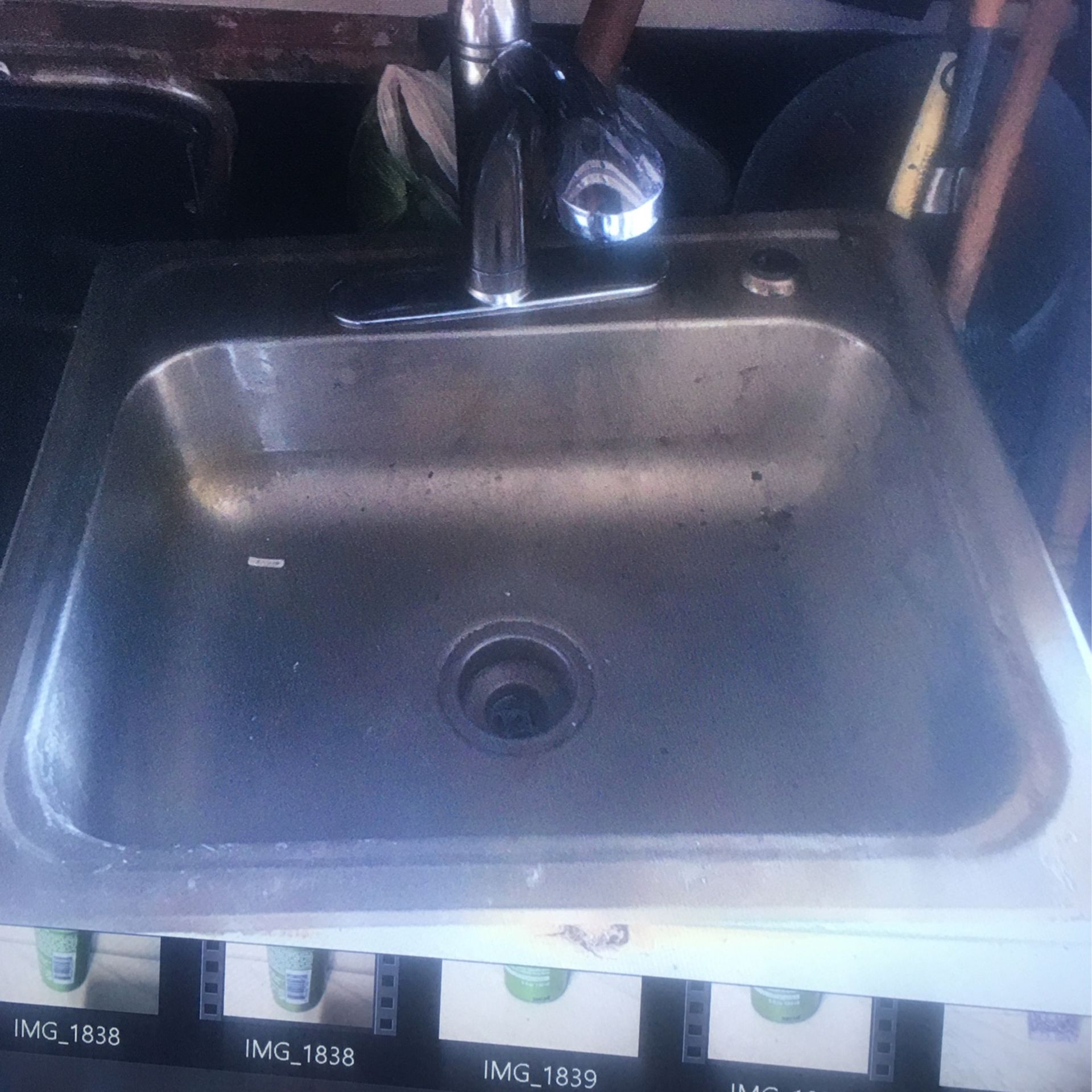 Stainless steel sink with faucet used