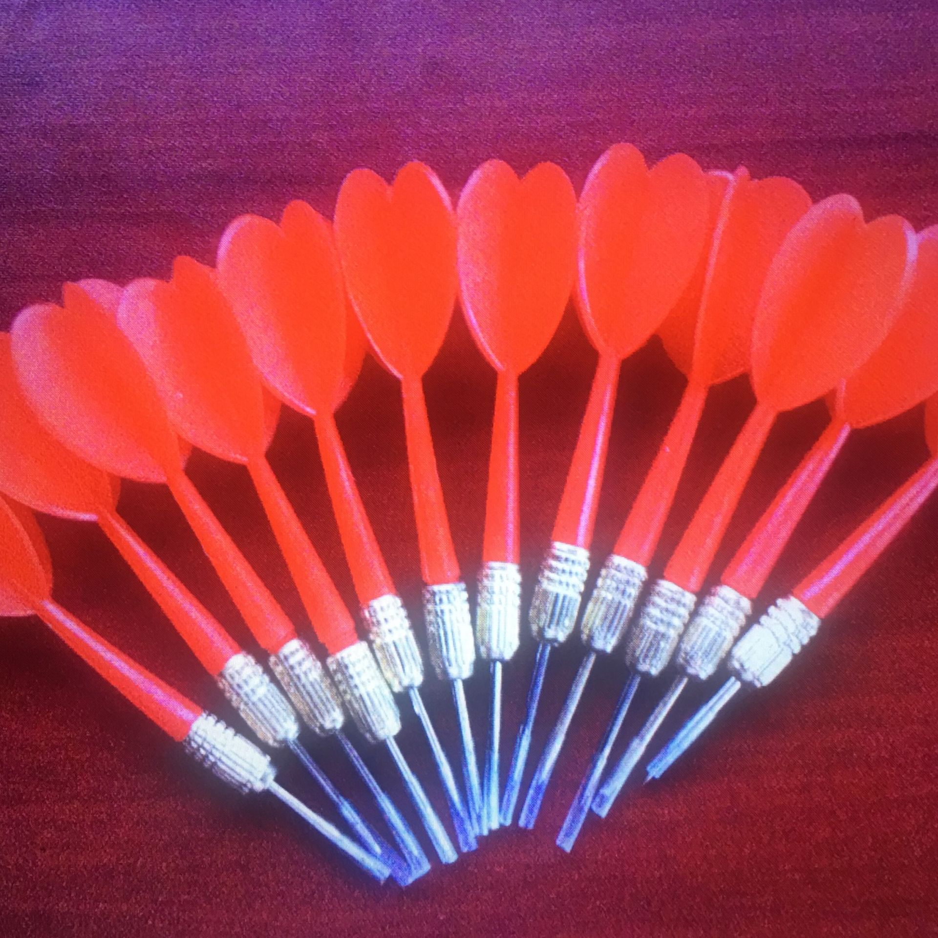 Pack of 12 red plastic darts