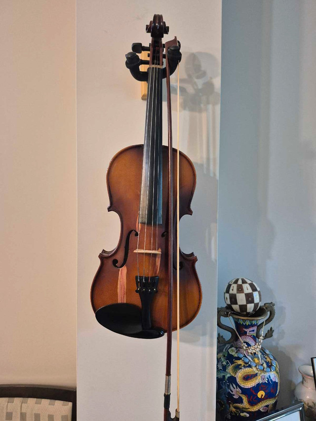 Violin and bow, no case.