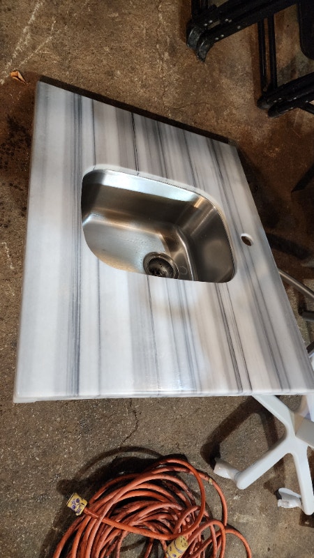 Stainless Sink and Solid Countertop Single