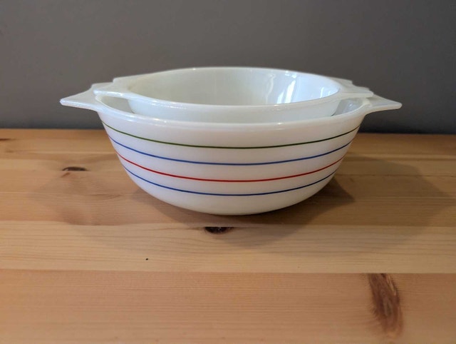 Two Pyrex England Spectrum striped bowls