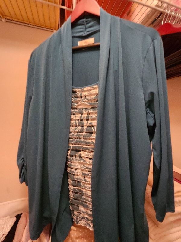 Long Sleeve blue blouse in great condition. Size XL. $25.