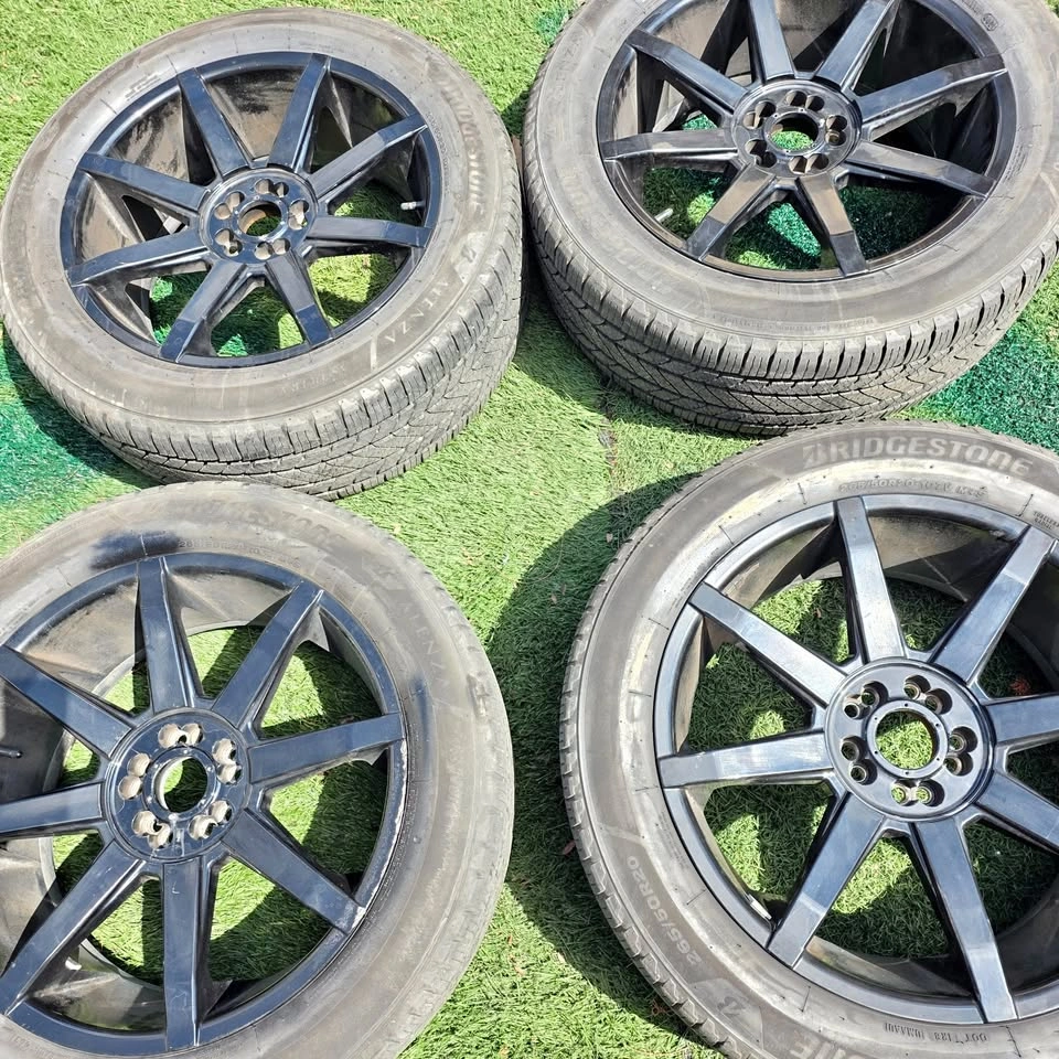 265/50/20 Bridgestone All Season Tires w/ Black Alloy Rims