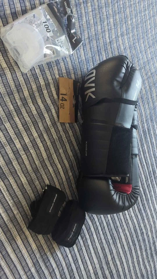 Boxing gloves, wraps, and mouthguard. New.