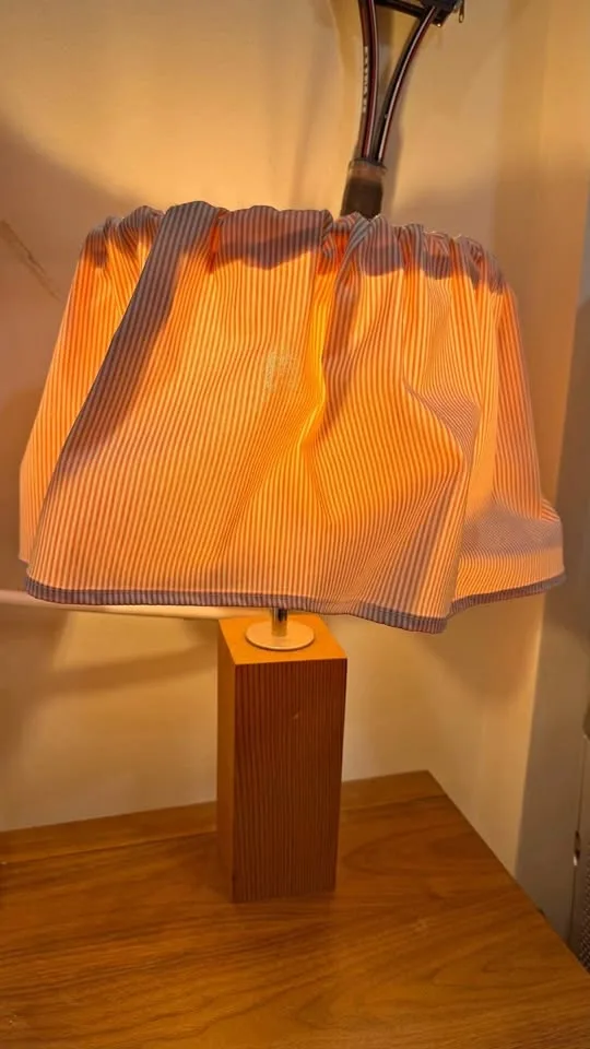 Table light with wood base and striped shade