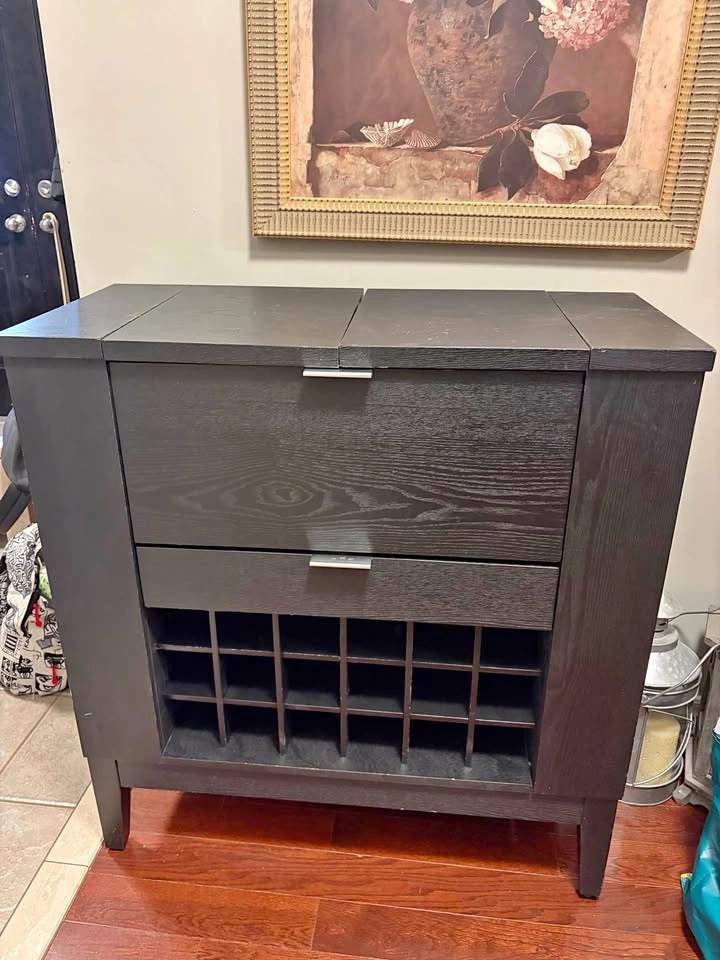 Bar with drawer, pull-out table, and side storage