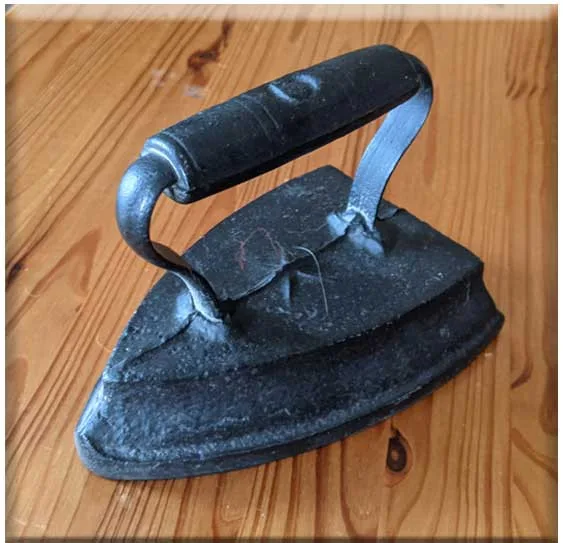 Assorted Antique Sad Irons and Trivet image indicator(4)