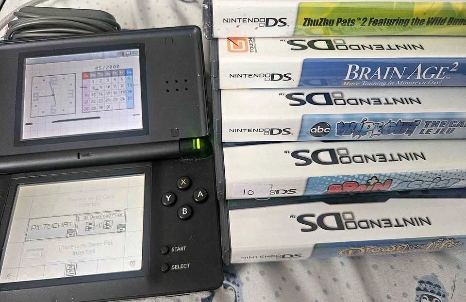 Nintendo DS Lite w/ games $80