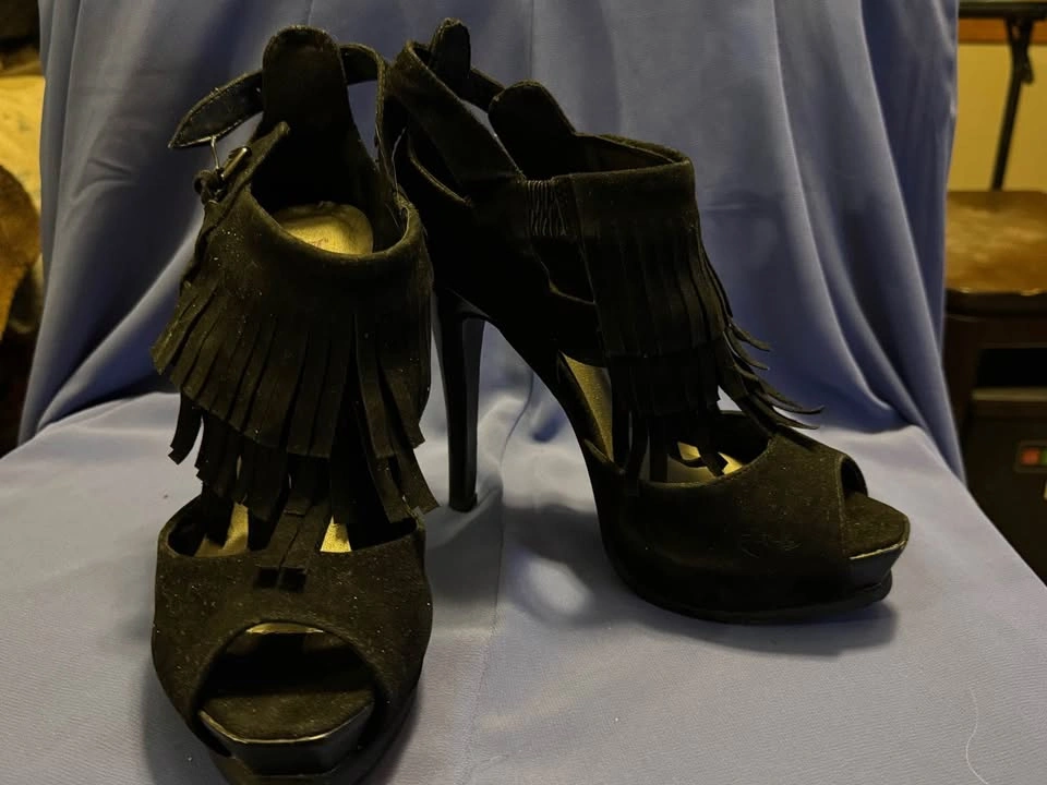 Black fringed high heel shoe