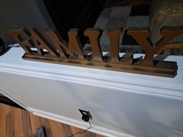 Brown wood finish family sign