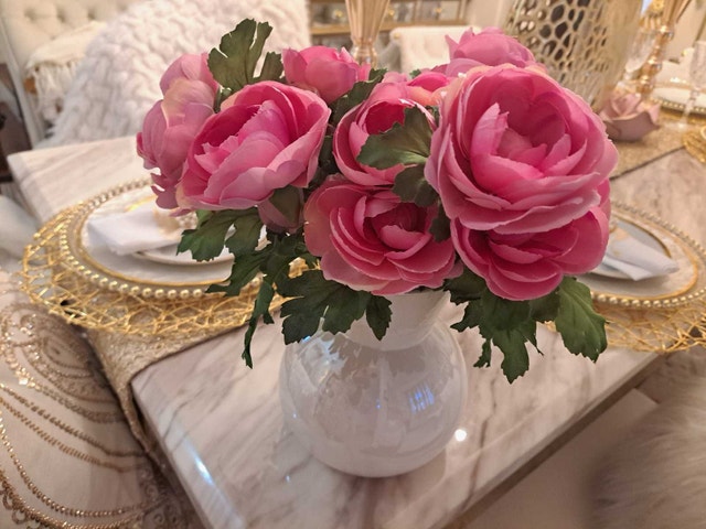 White vase with pink flowers