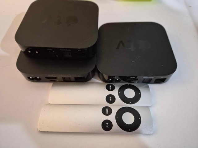 Lot of Apple TV's with remotes. Smart TV Box