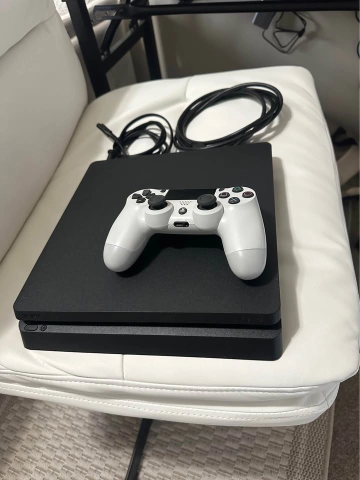 PlayStation 4 slim in like-new, mint condition - barely used. - photo 2