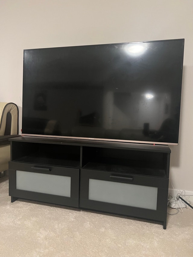 Skyworth TV and Modern Black TV Stand