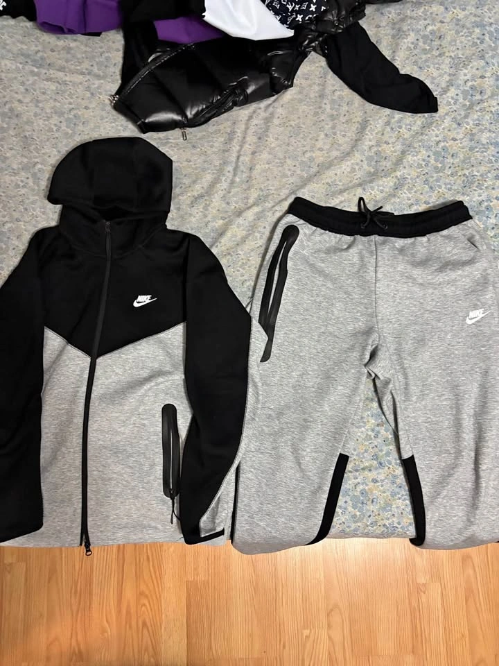 Gray and black Nike tech tracksuit