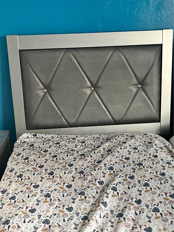 Twin bed with upholstered headboard