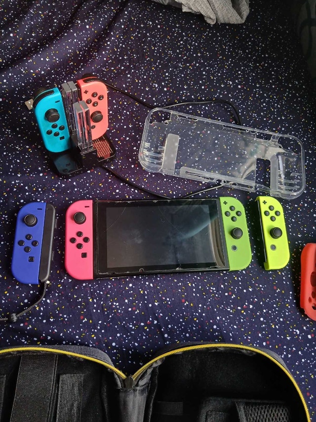 Nintendo Switch + 128GB SD Card + 3 Pairs of Joy-Cons