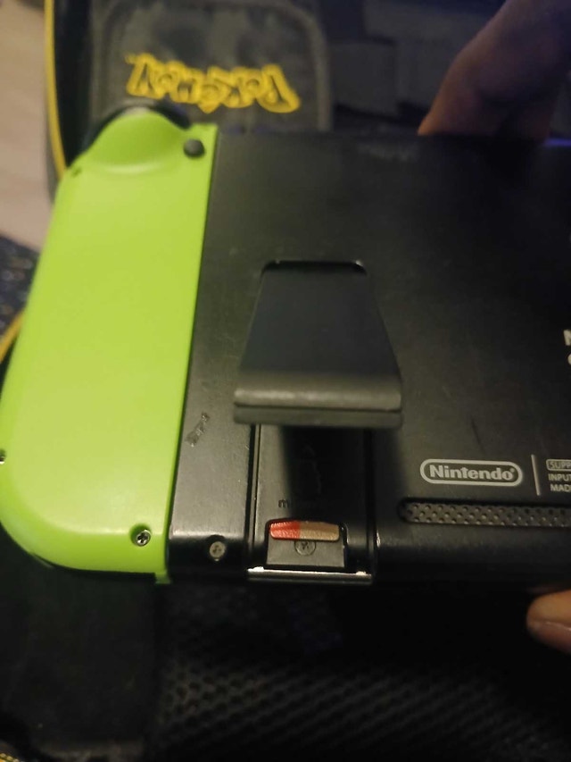 Nintendo Switch + 128GB SD Card + 3 Pairs of Joy-Cons - photo 2