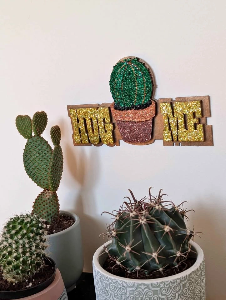 Wooden wall hanging with cactus