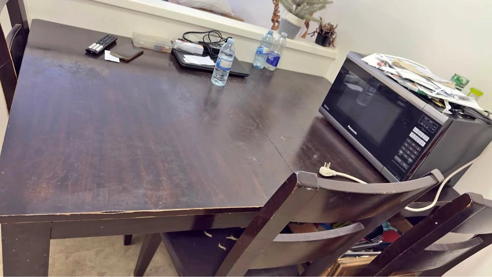 Dark brown dining table and 3 chairs