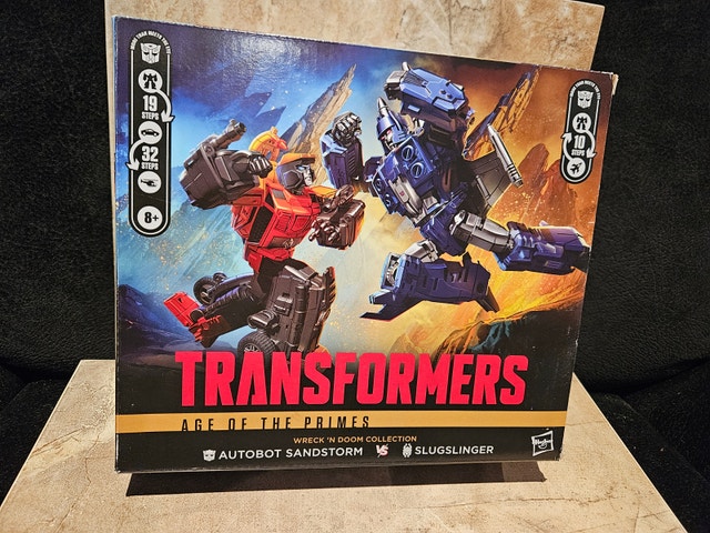 Transformers Age of The Primes Sandstorm vs Slugslinger