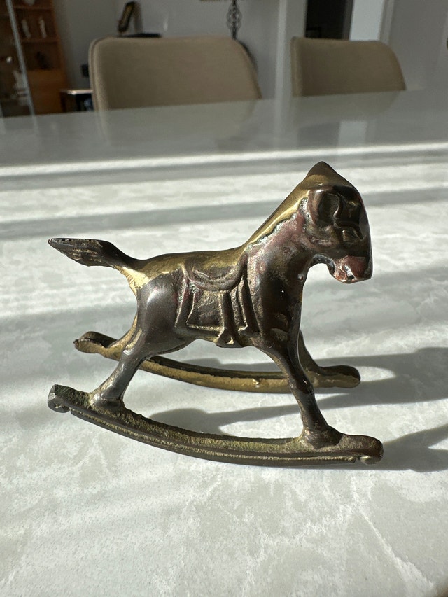 Solid brass vintage rocking horse figurine.